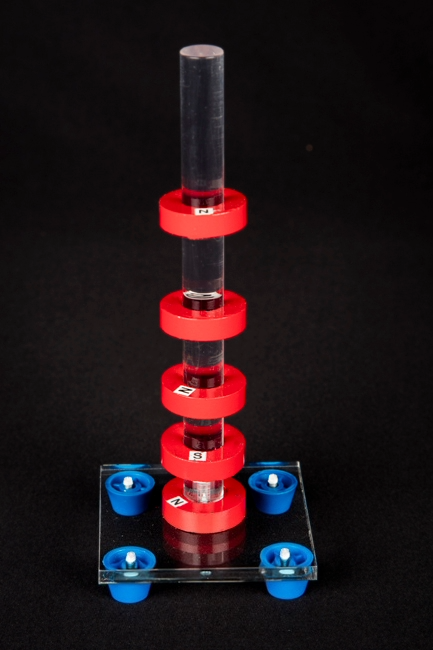 Magnetic Levitation apparatus, showing ring magnets levitating on a central acrylic rod